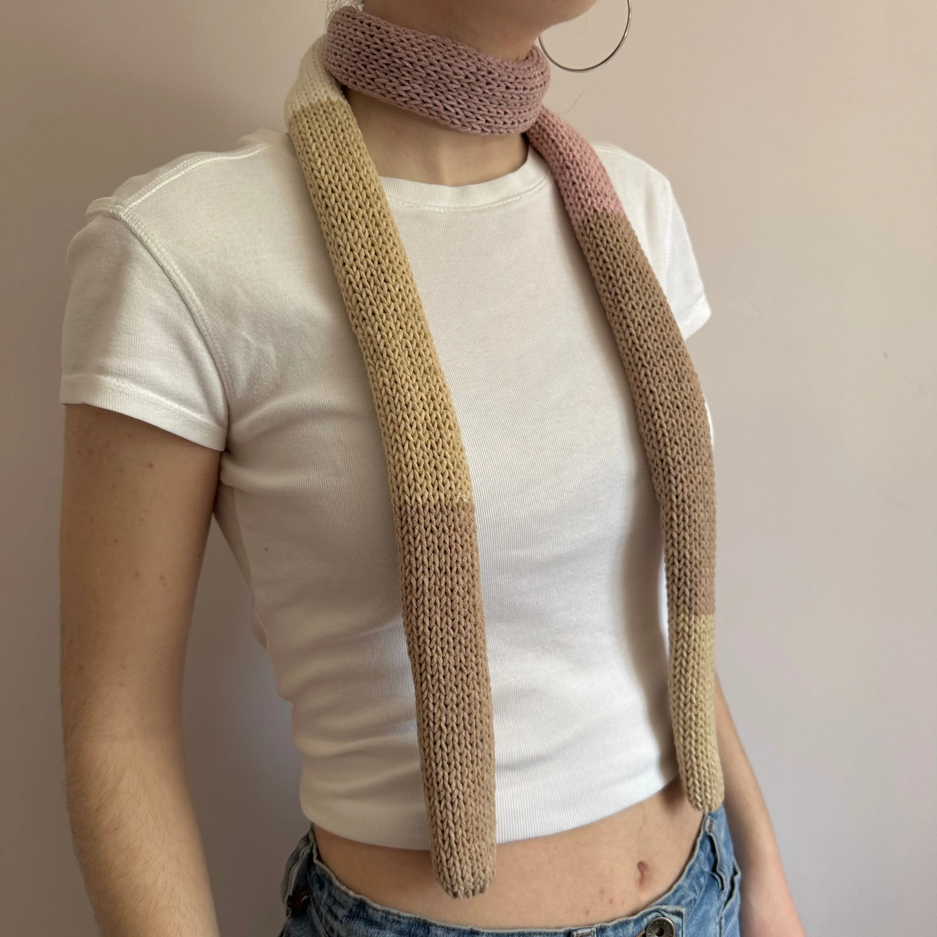 Handmade knitted colour block skinny scarf in beige and dusky pink